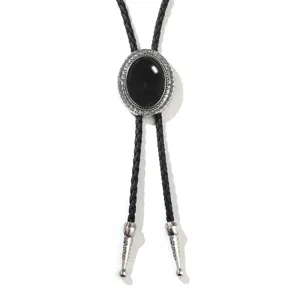 Vintage western bolo tie featuring a large black oval gemstone and braided leather cord