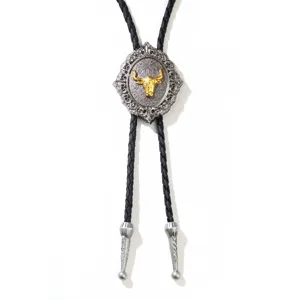 Vintage Western bolo tie featuring a golden bull head emblem on a silver alloy base