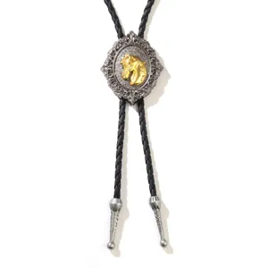 Vintage bolo tie with golden horse head on ornate silver medallion with braided cord