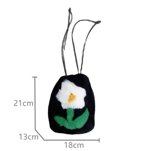 Close-up of cute furry drawstring mobile phone bag featuring a white flower design