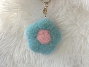 High-quality mink fur flower-shaped keychain charm with blue and pink petals close-up