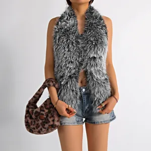 Detail of grey faux fur halter vest paired with a leopard print plush handbag.