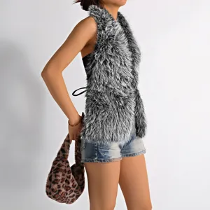 Detailed side view of a grey faux Mongolian fur halter top with long pile soft texture.
