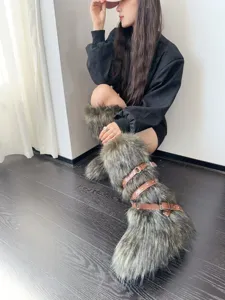 Faux fur Y2K punk snow boots with brown buckle straps and plush long hair design.