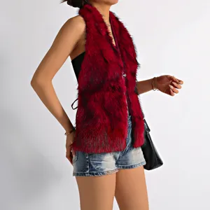 Side view detail of a red faux fur halter vest with sexy backless design and cross decor