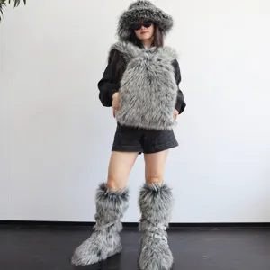Full body view of a model wearing a stylish grey faux fur backpack with Y2K winter fashion