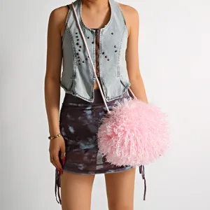 Furry pink crossbody bag with faux sheep hair texture for Y2K street style outfits