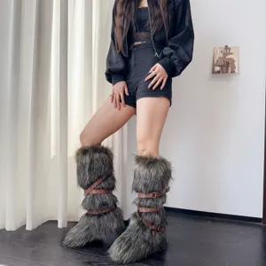 Close-up detail of women's stylish Y2K punk faux fur snow boots with brown buckle straps