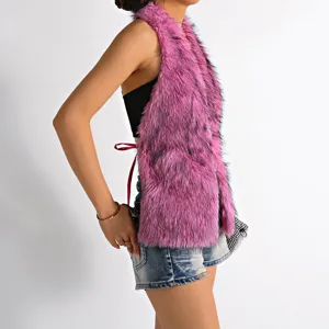 Side view detail of a vibrant pink Mongolian fur halter top with sexy open back design.