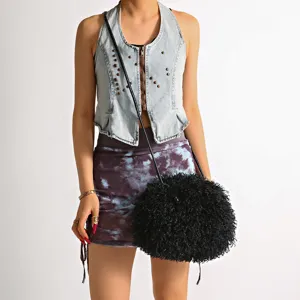 Chic black curly faux fur fluffy crossbody cloud bag detail on model streetwear look