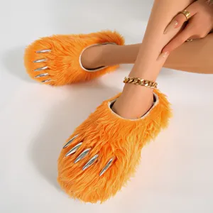 Stylish bright orange fuzzy animal claw slippers featuring sharp silver talons for cozy home wear