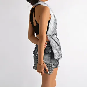 Detailed view of white faux fur halter top with sexy open back and cross design
