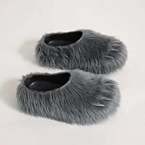 Detailed view of grey faux fur claw slippers with silver spikes and platform sole