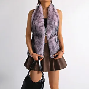 Detail shot of a pink and black faux fur halter neck vest on a model