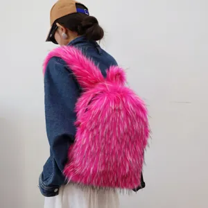 Trendy hot pink faux raccoon fur backpack shown on model for a bold Y2K style look