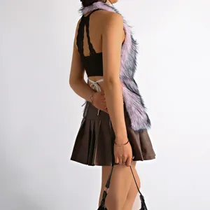 Close-up detail showing the texture of Mongolian faux fur vest and black lace top
