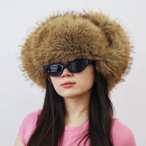 Oversized faux raccoon fur hat in Y2K style worn by an Asian model with sunglasses.
