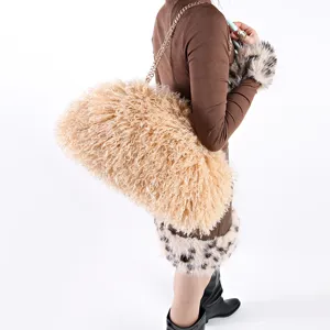 Detailed view of a large fluffy beige feather cloud bag featuring a gold chain strap