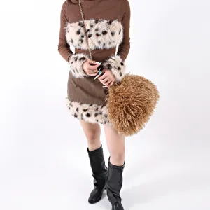 Detail view of large brown curly fur cloud bag styled with a chic leopard print outfit