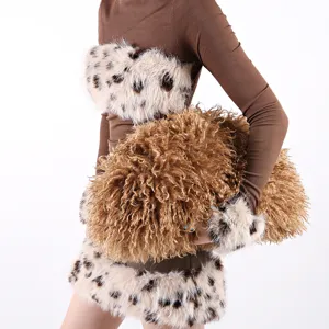 Detailed close-up showing the rich texture of a large brown curly faux fur cloud clutch bag