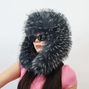 Close-up detail of an oversized dark grey faux raccoon fur trapper hat in Y2K style