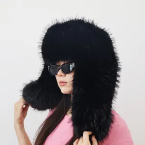 Close-up of a black oversized fluffy faux fur ushanka hat in a trendy Y2K aesthetic style.