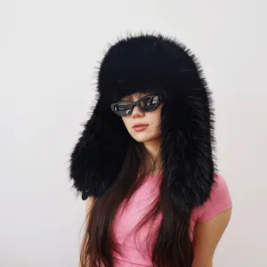 Detailed view of an oversized black faux raccoon fur trapper hat in Y2K style for women