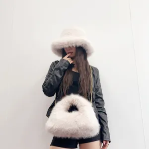 Stylish fashion matching set featuring a fluffy faux fur bucket hat and hobo bag in cream white