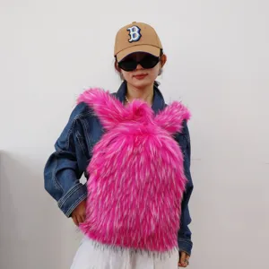 Close-up detail of a vibrant pink faux raccoon fur Y2K fashion backpack shown on a model
