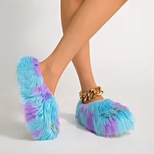 Detailed view of blue and purple furry monster claw slippers featuring metallic silver claws