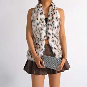 Detailed close-up view of leopard print faux fur halter vest featuring a cross charm decoration