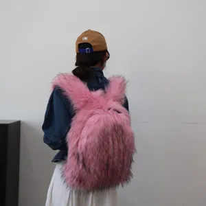 Detailed view of the oversized pink faux raccoon fur backpack featuring trendy Y2K style