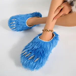Detail view of fluffy blue claw slippers with metallic silver talons on soft faux fur.