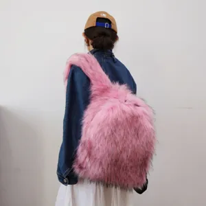Rear view of a trendy large pink faux fur backpack with Y2K aesthetic on a model