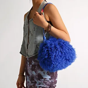 Vibrant blue faux fur shoulder bag with curly Tibetan lamb wool texture