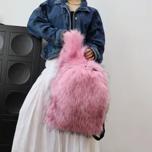 Detail shot of a pink faux raccoon fur backpack in trendy Y2K style for men and women