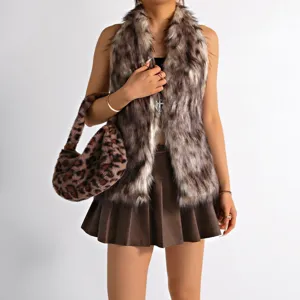 Front view detail of a faux fur halter vest with cross necklace and leopard print