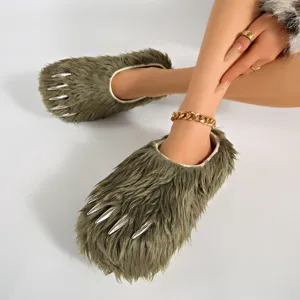 Close-up detail of green faux fur claw slippers with silver metallic talons on feet