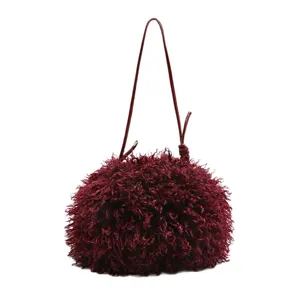 Elegant burgundy faux sheep fur cloud bag with a thin shoulder strap for stylish women