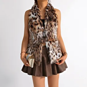 Close-up detail of sexy leopard print faux fur vest with a cross pendant necklace