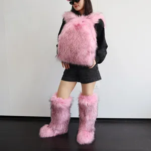 Detail view of a pink Y2K style faux fur backpack and matching furry leg warmers