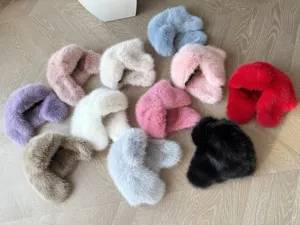 Detailed collection of colorful faux fox fur aviator hats in various winter shades.