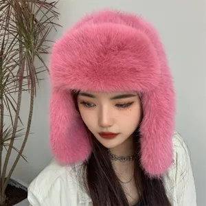 Detailed view of pink faux fur trapper hat showing soft plush texture and warm ear flaps