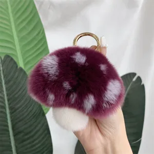 Detailed view of the soft purple mushroom plush keychain made of rex rabbit fur