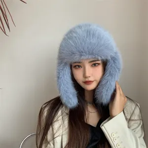 Close-up of a light blue faux fur trapper hat with plush earflaps for winter warmth and style