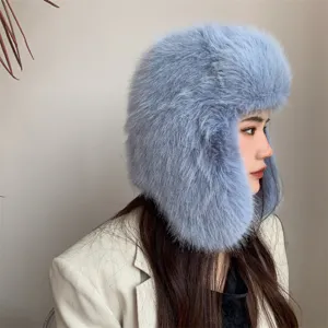 Close-up detail of a light blue faux fox fur trapper hat featuring warm ear protection