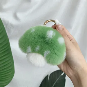 Soft green plush mushroom keychain made of fluffy Rex rabbit fur for bag decor