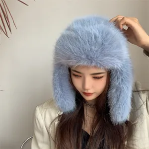 Detailed view of a stylish light blue faux fox fur ushanka hat for winter warmth and comfort