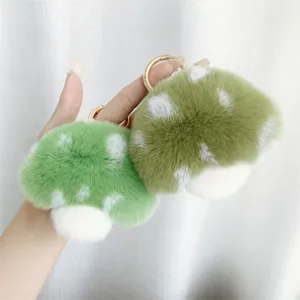 Cute mushroom faux fur keychains in mint green and olive colors with white spots decoration