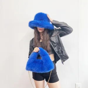 Vibrant blue faux fox fur bucket hat and matching hobo bag set for stylish winter fashion